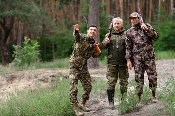 Hunters Father and Sons Guy Pointing to Wildfowl.