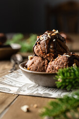 chocolate sorbet on a plate. Christmas decorations. Chocolate dessert. Chocolate ice cream balls