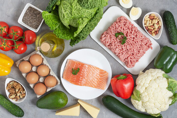 Ingredients for ketogenic diet top view on grey concrete table.