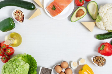 Ingredients for ketogenic diet top view on white wooden table.