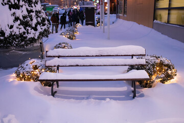 Bench on the snow on winter