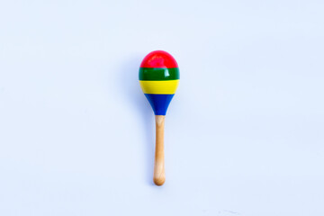 Wooden rattle on white background. Copy space