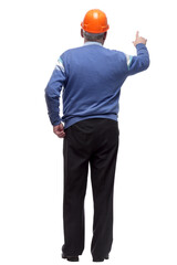 architect in a protective helmet is pointing at a large white screen