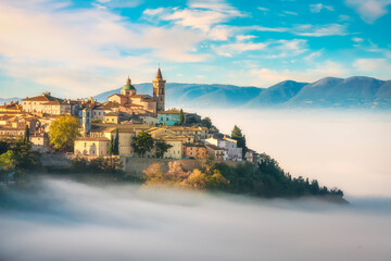 Trevi picturesque village in a foggy morning. Perugia, Umbria, Italy. - 391757678
