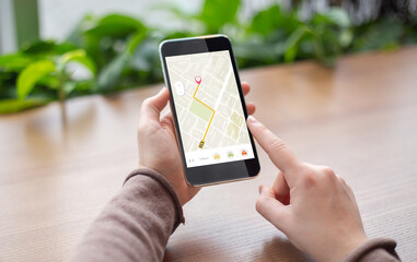 Lady With Smartphone Booking Taxi Via Mobile Application In Cafe