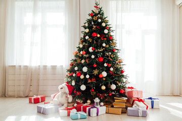 Christmas tree by the window interior of the room New Year holiday gifts