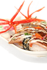 Healthy Home Cooking - Grilled pork sushi placed on a white plate, is a Japanese style Thai food on a white background and is sold at Thailand and every festival.