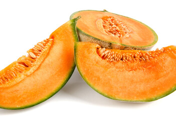 Half of the cantaloupe melon and a piece of melon are isolated on a white background.