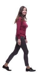 in full growth. happy young woman striding forward