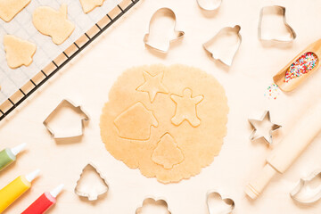 Cooking christmas gingerbread cookies on wooden background