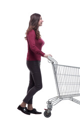 side view. casual young woman pushing shopping cart
