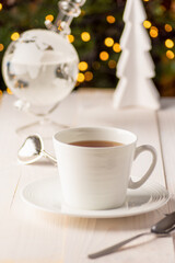 a cup of tea and christmas decorations, weather teller 