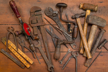 Vintage tools on a wooden background