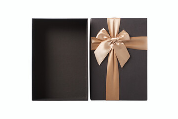 Opened black gift box with golden ribbon isolated on white background. Isolate.