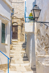 Traditional cycladitic   alley with narrow street and  whitewashed  houses in ano Syros Greece