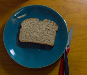 Peanut butter on toast on green plate on wooden table and hot espresso coffee