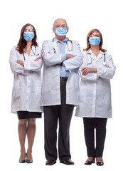 group of doctors in protective masks looking at you