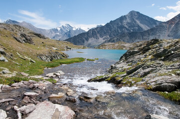Fototapeta na wymiar The Valley of the Seven lakes with melting glaciers forming a small mountain lake, the Altai Republic, Russian Federation