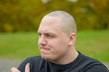 Thoughtful young man looking off to the side