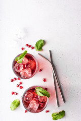 pomegranate juice with pomegranate seeds, mint and ice