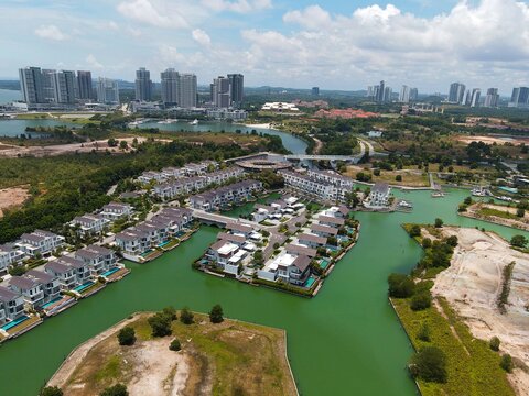 Emerald Bay residences on man-made island, aerial photography with bungalow houses and villas near Iskandar Puteri of Puteri Harbour