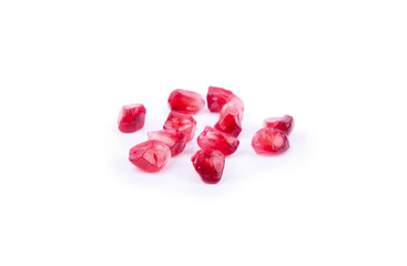 Ripe pomegranate seeds on white backgound