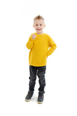 Handsome little boy pointing at you. Dressed in casuals. Isolated on white background
