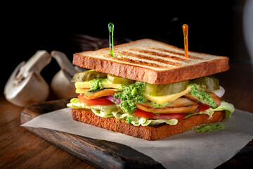 Vegetarian club Sandwich with fried mushrooms, vegetables and guacamole sauce