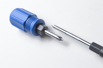 Phillips screwdriver and small screwdriver on white background