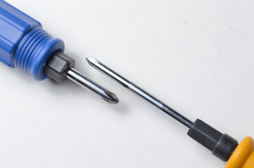 Phillips screwdriver and small screwdriver on white background