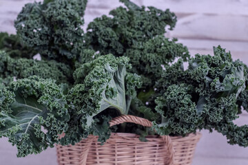 Kale basket outside in daylight top view, Winter superfoods