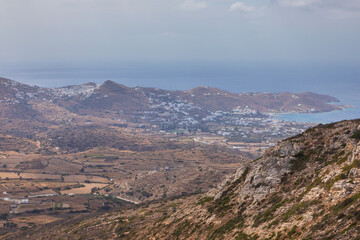 Fototapeta na wymiar View of the Chora and port at Aegean Sea, Ios Island, Greece.