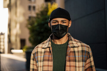 Young handsome man walking on a street
