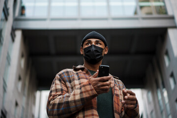 Young african man wearing safety mask