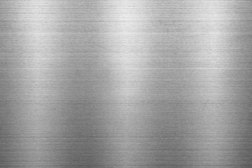 Silver metal texture of brushed stainless steel plate with the reflection of light.