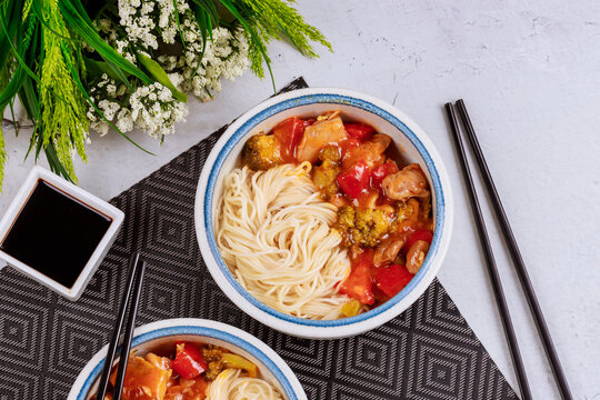 Boiled rice noodles with broccoli, chicken and bell pepper in sweet and spisy sauce.