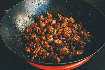 meat stew in a wok pan