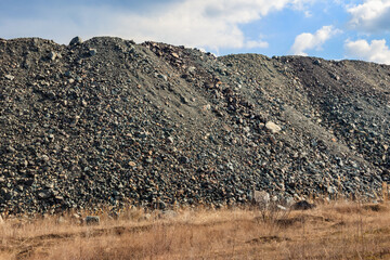 View of slag heaps of iron ore quarry. Mining industry