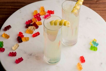 Cocktails. Traditional American drinks made by artisanal bartenders or mixologists in speakeasy & upscale bars or dives or taverns.Cocktails served in chilled cocktail glasses & garnished with fruit.