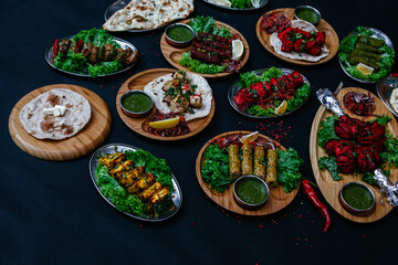 black table with indian dishes