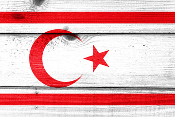 the Turkish Republic of Northern Cyprus flag painted on old wood plank background. Wooden texture...