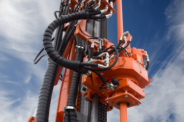 Oil or gas drilling rig, part of drive system for oil and natural gas industry over blue sky