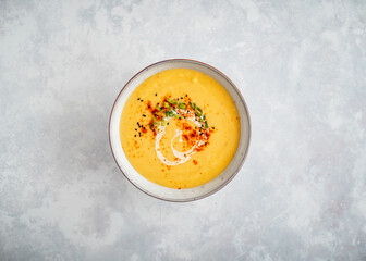 Parsnip cream soup on grey background food photography