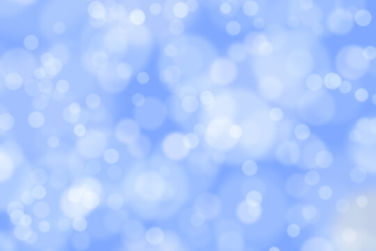 Abstract twinkled bright light blue background with bokeh defocused blur
