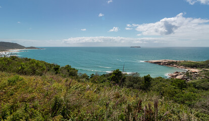 bay with sky and blue sea, between Mole and Gravatá beaches, Florianópolis, Brazil