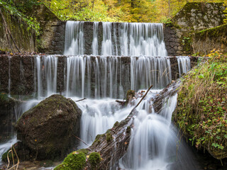 Waterfall in the forests of the Carpathian Mountains in Sinaia, Romania.