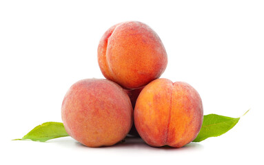Three ripe peaches with leaves.