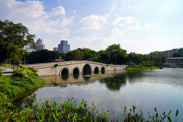 Fototapeta na wymiar pedestrian bridge over the lake in the Park. Liwan Lake park. Guangzhou, China 