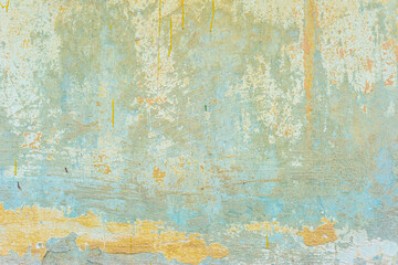 green old texture of plaster on the wall of a street house