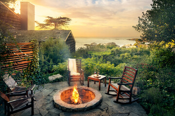 Outdoor fireplace by cabin and ocean - obrazy, fototapety, plakaty